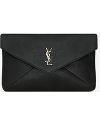 Saint Laurent - Große cassandre envelope pouch aus genarbtem lammleder schwarz - Lyst