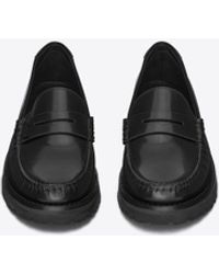 Saint Laurent - Le loafer monogram penny slippers aus glasiertem leder mit dicker sohle schwarz - Lyst