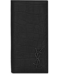 Saint Laurent Cassandre langes portemonnaie aus schwarzem leder mit krokodillederprägung