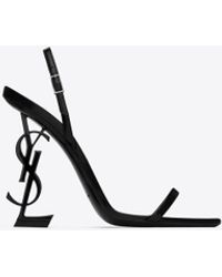 Saint Laurent - Opyum slingback-sandalen aus glasiertem leder schwarz - Lyst