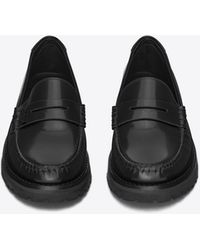 Saint Laurent Le loafer monogram penny slippers aus glattleder mit dicker sohle - Schwarz