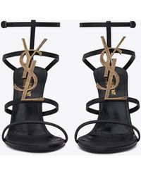 Saint Laurent Cassandra sandales en cuir verni et logo noir (110)