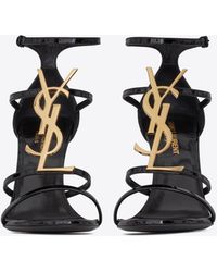 Saint Laurent Cassandra Sandals In Patent Leather With Gold-tone Monogram - Black