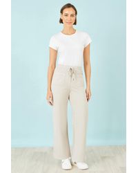 Yumi' - Cream Relaxed Stretch Wide Leg Trousers With Pockets - Lyst