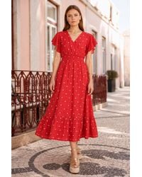 Yumi' - Broderie Anglaise Wrap Midi Dress With Flower Embroidery - Lyst