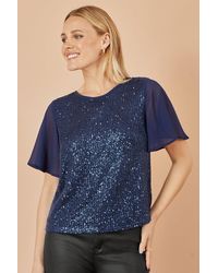 Yumi' - Sequin Top With Sheer Sleeves And Cut Out Back - Lyst
