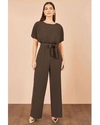 Yumi' - Batwing Stretch Jumpsuit - Lyst