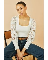 Yumi' - Ribbed Knitted Top With Lace Sleeves - Lyst