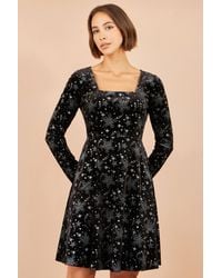 Yumi' - Starburst Foil Print Long Sleeve Skater Dress - Lyst