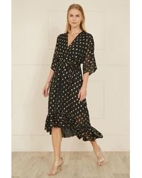Yumi' - Foil Print Wrap Over Dip Hem Midi Dress - Lyst