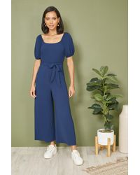 Yumi' - Square Neck Puff Sleeve Culotte Jumpsuit - Lyst