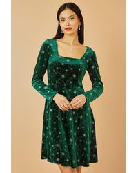 Yumi' - Starburst Foil Print Long Sleeve Skater Dress - Lyst