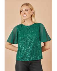 Yumi' - Sequin Top With Sheer Sleeves And Cut Out Back - Lyst