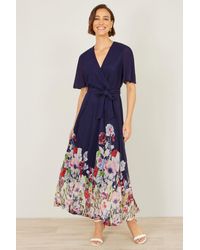 Yumi' - Mesh Wrap Midi Dress With Floral Hem Border - Lyst