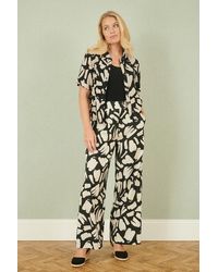 Yumi' - Cotton Splash Print Relaxed Fit Trousers - Lyst