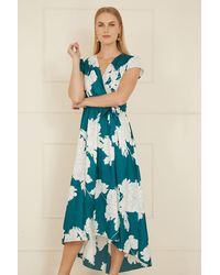 Yumi' - Blossom Print Wrap Midi With Dipped Hem - Lyst