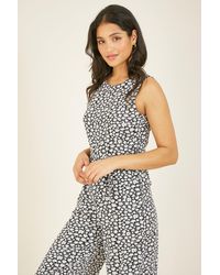 Mela - Ditsy Daisy Sleeveless Culotte Jumpsuit - Lyst