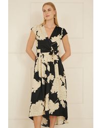 Yumi' - Blossom Print Wrap Midi With Dipped Hem - Lyst