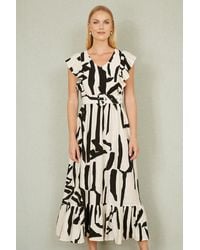 Yumi' - Ivory Abstract Print Viscose Midi Dress With Matching Belt - Lyst