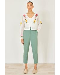 Yumi' - Stretch Capri Pants With Tie Belt - Lyst