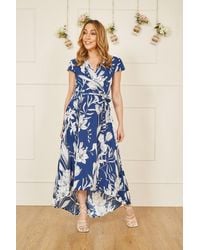 Mela London - Mela Leaf Print Dipped Hem Wrap Dress - Lyst