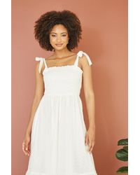 Mela London - Mela Broderie Anglaise Ruched Midi Sundress With Tie Sleeves - Lyst