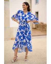 Yumi' - Kimono Sleeves Midi Dip Hem Wrap Midi Dress - Lyst