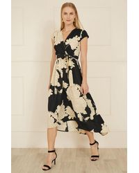 Yumi' - Blossom Print Wrap Midi With Dipped Hem - Lyst