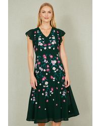 Yumi' - All Over Floral Embroidery Midi Skater Dress - Lyst