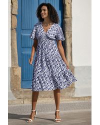 Yumi' - Floral Ruched Waist Midi Dress With Angel Sleeves - Lyst