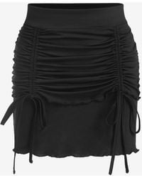 Zaful Mini falda con adorno de pliegue de vieira frontal - Negro