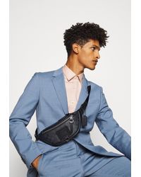 disney x coach signature rivington belt bag with dumbo