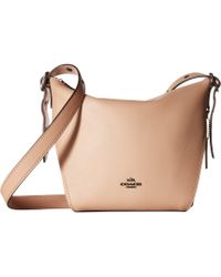 Lyst Coach Polished Pebble Leather Dufflette In Brown Coach Small Dufflette In Natural Calf Leather Dk Oxblood Handbags Lyst