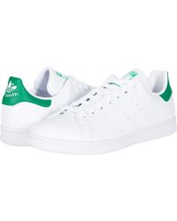 adidas originals stan smith sneakers with reptile back counter
