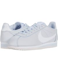 nike white leather tennis shoes