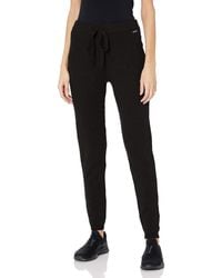 Guess Pants for Women - Up to 77% off at Lyst.com