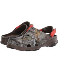 all terrain crocs tan