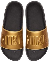 buy nike slippers at 50 off