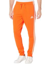 adidas Essentials 3-stripes Tapered Cuff Fleece Pants - Orange