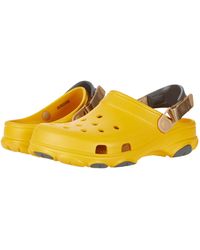 classic all terrain crocs tan