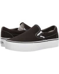 vans black platform slip ons