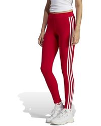 Adidas originals three stripe cigarette pants in orange deals