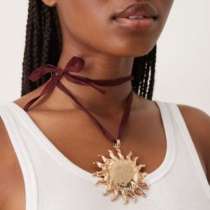 ASOS Natural Necklace On Burgundy Ribbon Cord With Large Sun Pendant