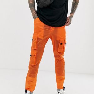 Pantalon cargo fuselé transparent ASOS pour homme en coloris Orange