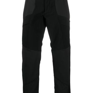 Pantaloni slim con pannelli a contrasto di White Mountaineering in Nero da Uomo