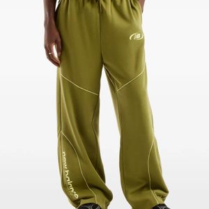 New Balance Green Trackside Piped Track Pants for men