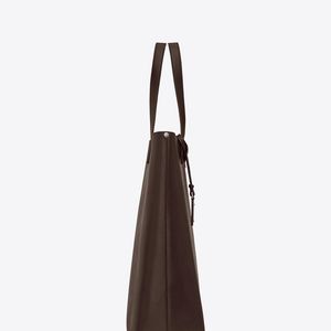 Bold sac shopping en cuir vintage et logo perforé Saint Laurent pour homme en coloris Marron