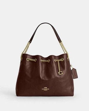 COACH Evelyn Shoulder Bag With Quilting And Charm - Brown