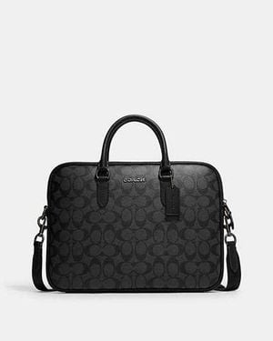 Maletin coach hombre precio sale