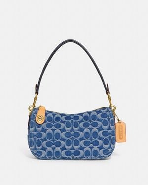 COACH Swinger In Signature Denim - Blue